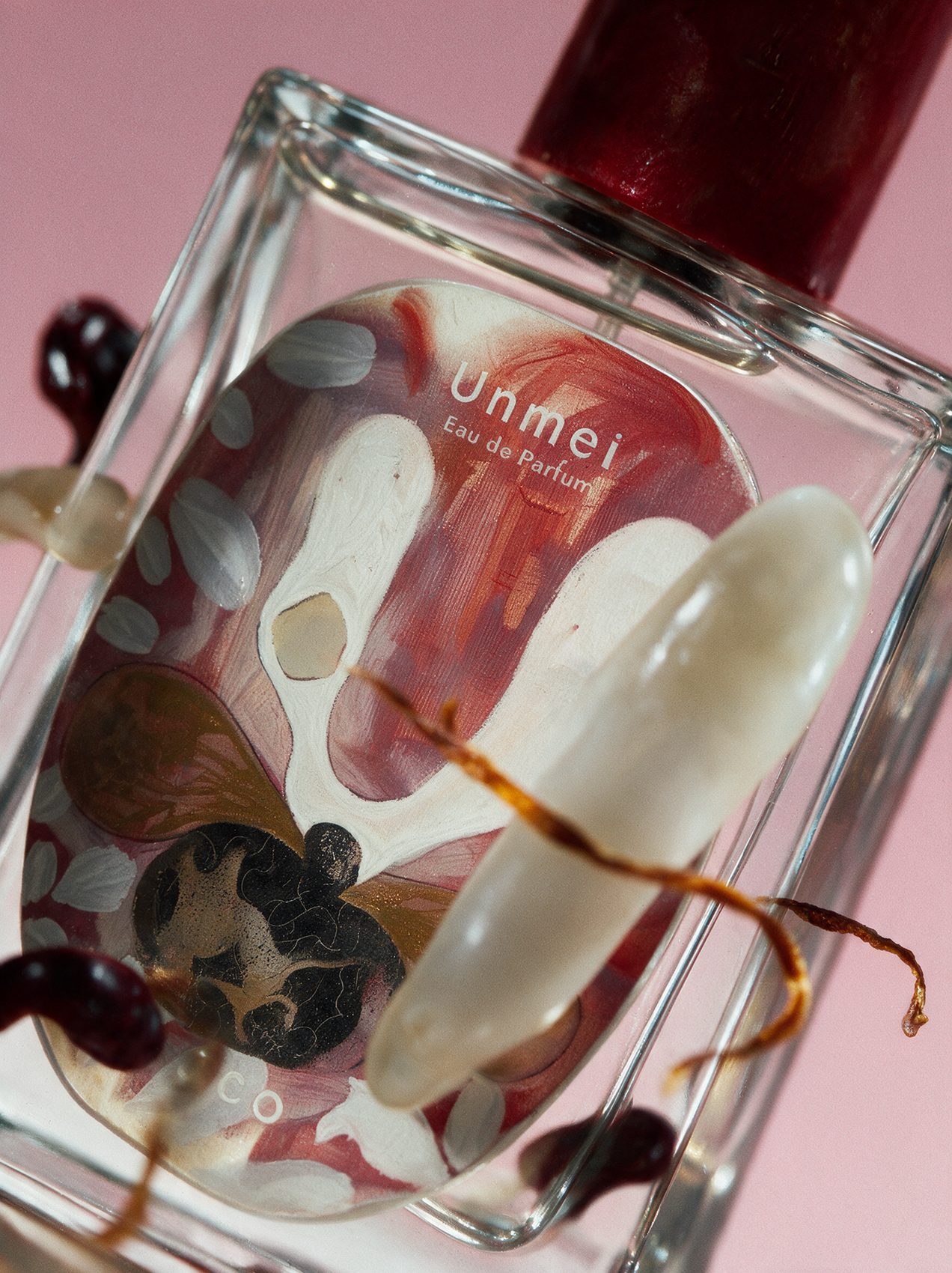 Unmei bottle close-up with ingredients inside the glass